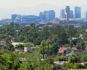 Looking over green treetops toward downtown Phoenix