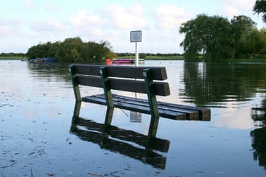 Park bench in flooded area