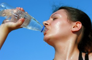 Woman Drinking from water bottle
