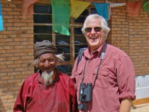 A smiling Smith with a Tibetan pastoralist