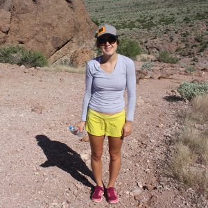 Lexie standing on a desert hiking trail