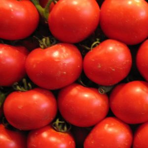 A crate of ripe red tomatoes 