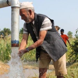 Nepali Man pumping water