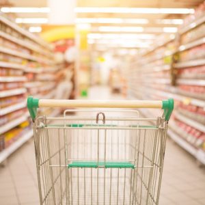 Shopping Cart in Grocery Store Aisle