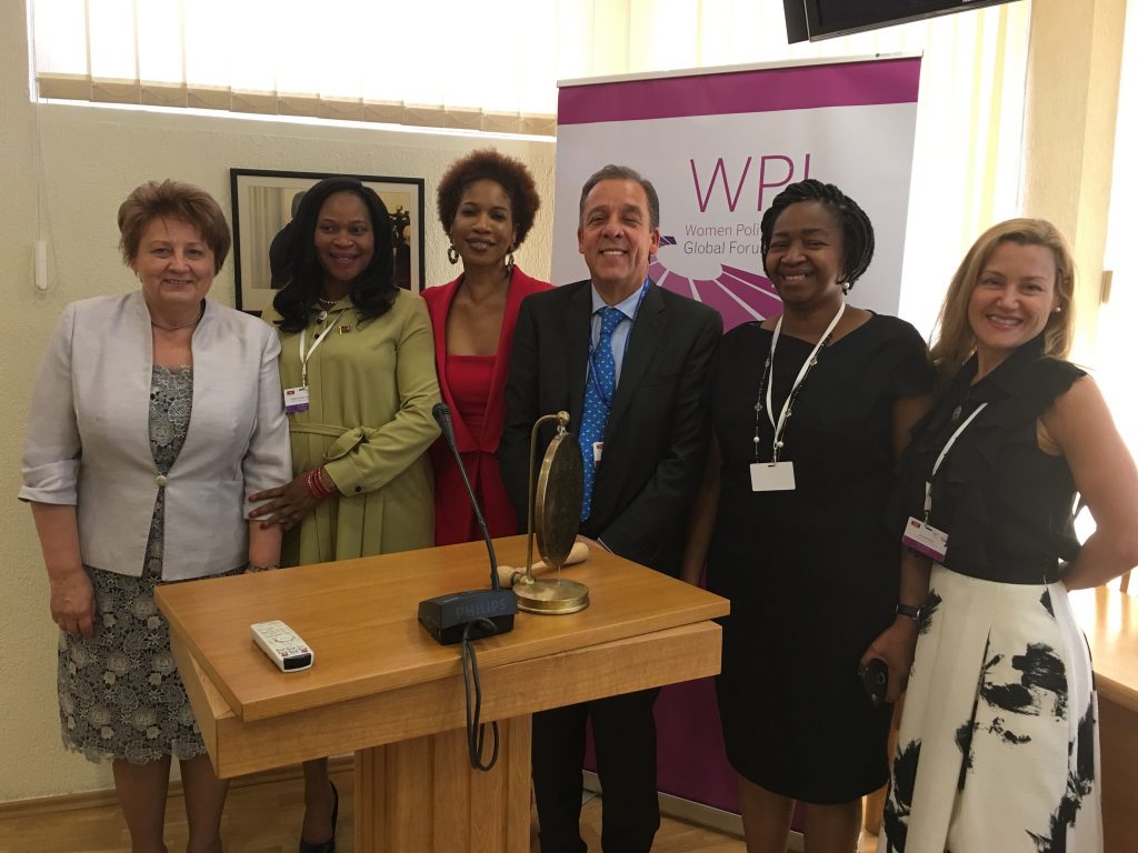 Amanda Ellis, right, stands with five leaders at the Women Political Leaders Summit 2018