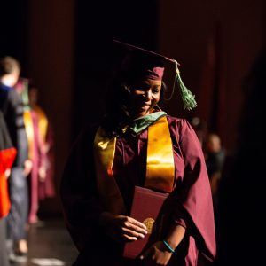 ASU student walks across the stage at School of Sustainability convocation