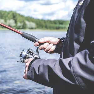 Closeup of man holding fishing gear