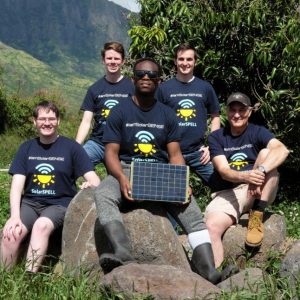 SolarSPELL students posing with solar panel