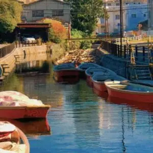 Japanese canal with red boats