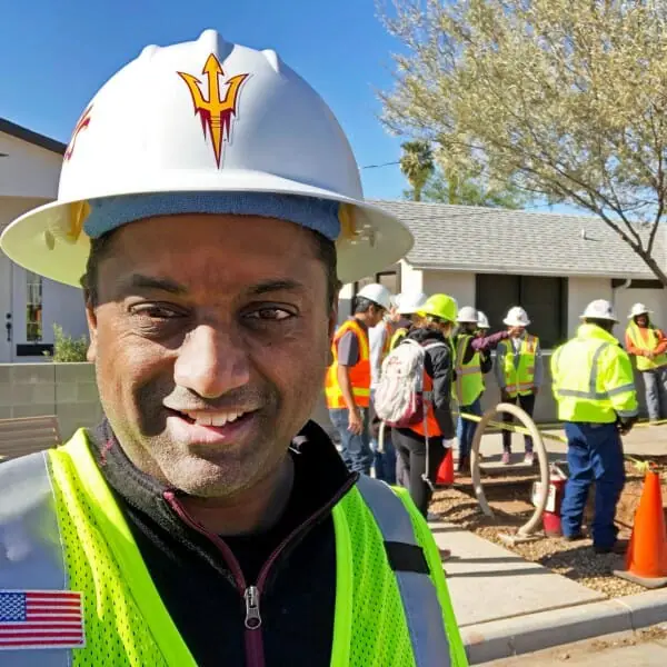 Samuel Ariaratnam in hard had at construction site
