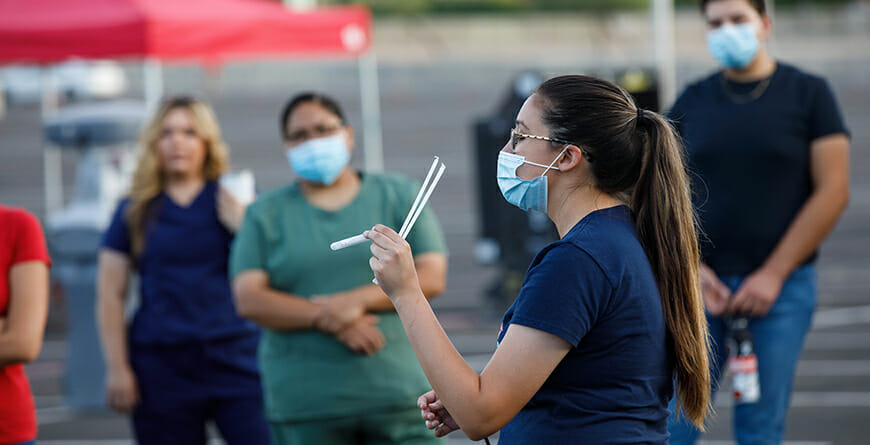 Volunteers helping setup saliva testing site.