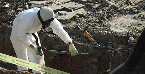 Man in hazmat suit at a contaminated site