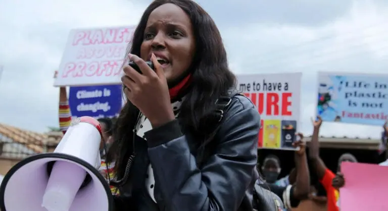 Vanessa Nakate at event speaking to the crowd over a megaphone