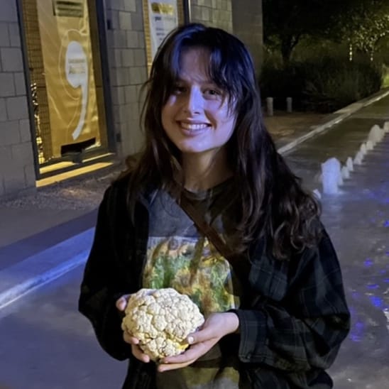 Elora Bevacqua holding a cauliflower head.