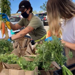 People looking at produce at the Prescott Farmers Market