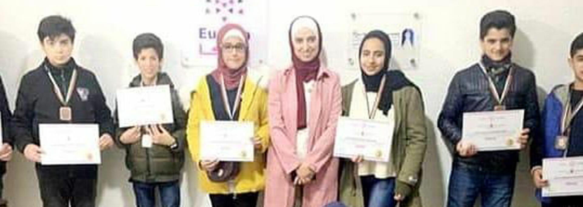 Eureka graduates posing with diplomas
