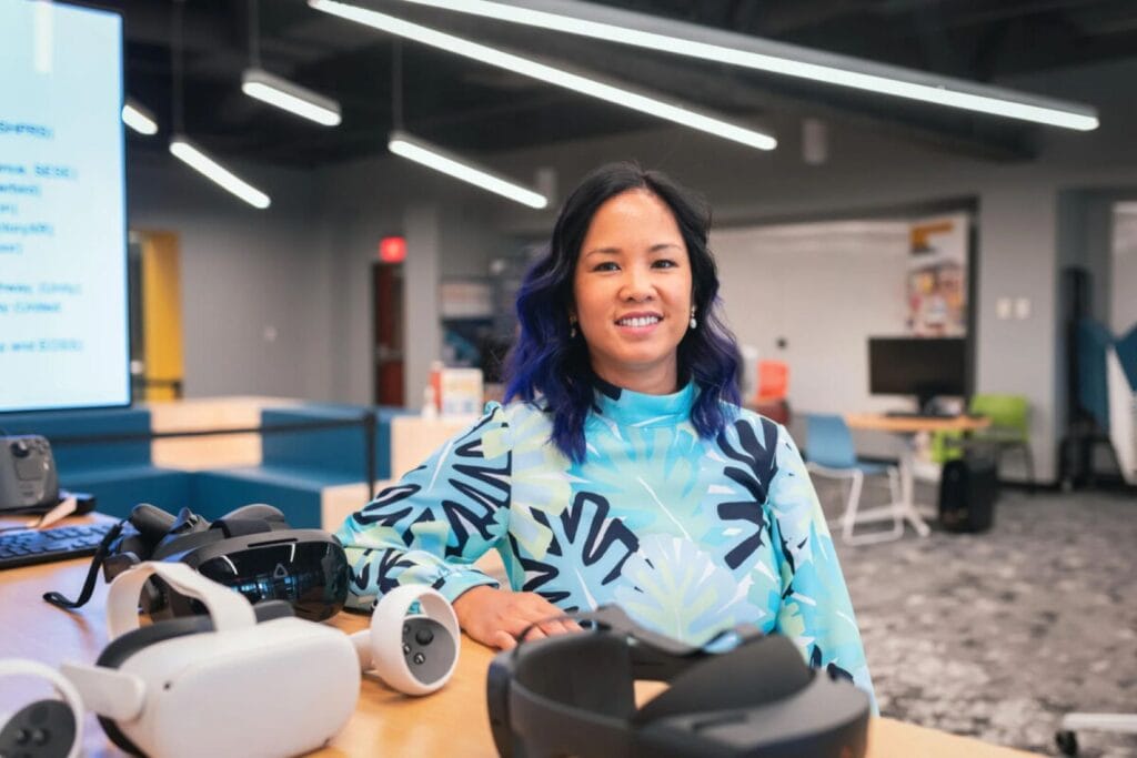 Bea Rodriguez-Fransen surrounded by VR technology.